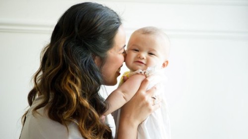smiling-mum-holding-baby (1).jpg